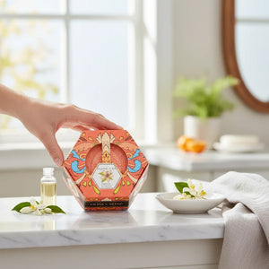 Potager Soap Co. Baudelaire Orange Blossom Honey soap in a decorative hexagonal box held on a marble countertop.