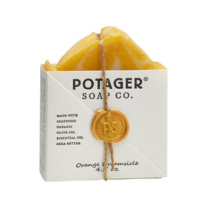 Potager Soap Co. Orange Creamsicle artisan soap bar in white paper packaging with a gold wax seal and twine tie.