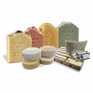Potager Soap Co. organic botanical shower kit with four soap bars, shower steamers, wooden soap dish, and sisal bag.