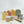 Potager Soap Co. organic botanical shower kit with four soap bars, shower steamers, wooden soap dish, and scrubby bag.