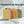 Potager Soap Co. organic botanical soap bars in four natural shades with embossed branding on a marble surface.