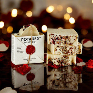 Potager Soap Co. Secret Garden organic castile soap bars with dried flower petals and signature wax seal packaging.