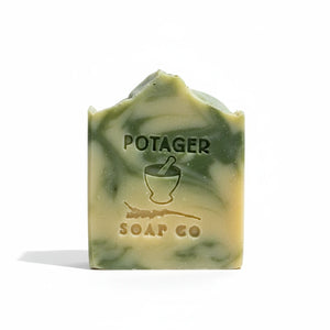 Potager Soap Co. rosemary lemongrass artisan bar soap with green clay swirls and embossed logo on white background