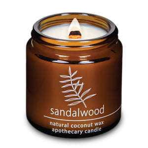 Potager Soap Co. HEMLOCK PARK sandalwood coconut wax candle in an amber glass jar with a lit wooden wick