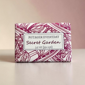 Potager Soap Co. Secret Garden bar soap in decorative white and magenta botanical patterned paper wrapping.