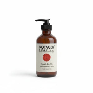 Potager Soap Co. Secret Garden hand and body lotion in an amber glass bottle with a black pump dispenser.