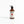 Potager Soap Co. Secret Garden hand and body lotion in an amber glass bottle with a black pump dispenser.