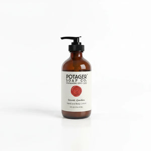 Potager Soap Co. Secret Garden hand and body lotion in an amber glass bottle with a black pump dispenser.