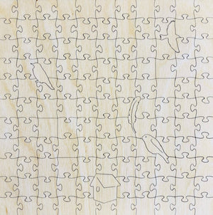 Potager Soap Co. wooden jigsaw puzzle featuring laser-cut whimsy shapes of birds, feathers, and a birdhouse.