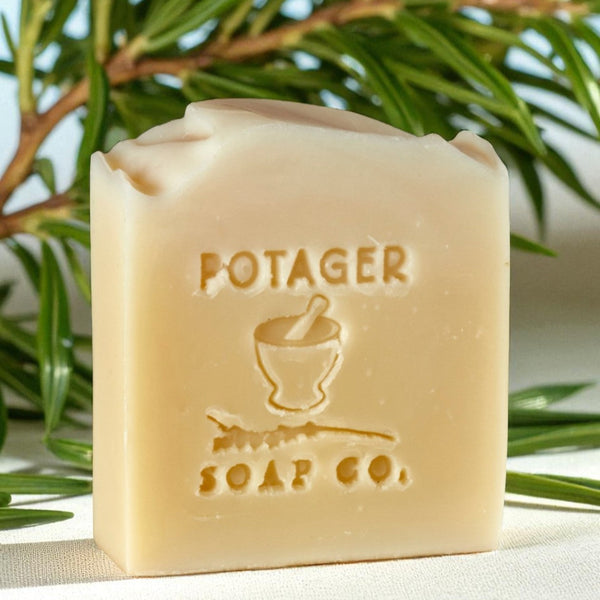 Bar of soap with 'Potager Soap Co.' branding against a natural background