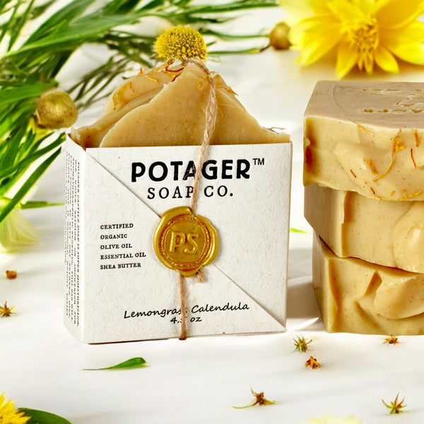 POTAGER SOAP CO. soap bars with packaging on a white background with flowers.